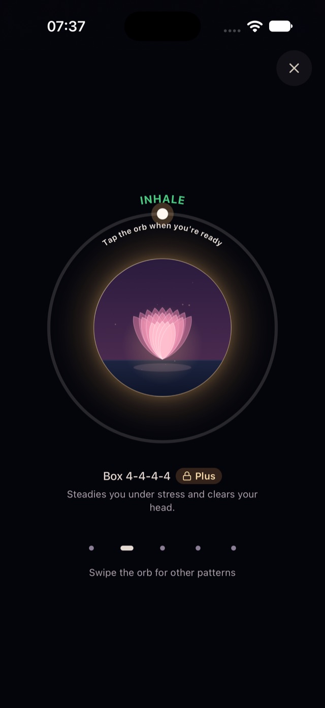Aama's Breathe screen: a glowing lotus inside a breathing circle that guides a box breathing exercise.